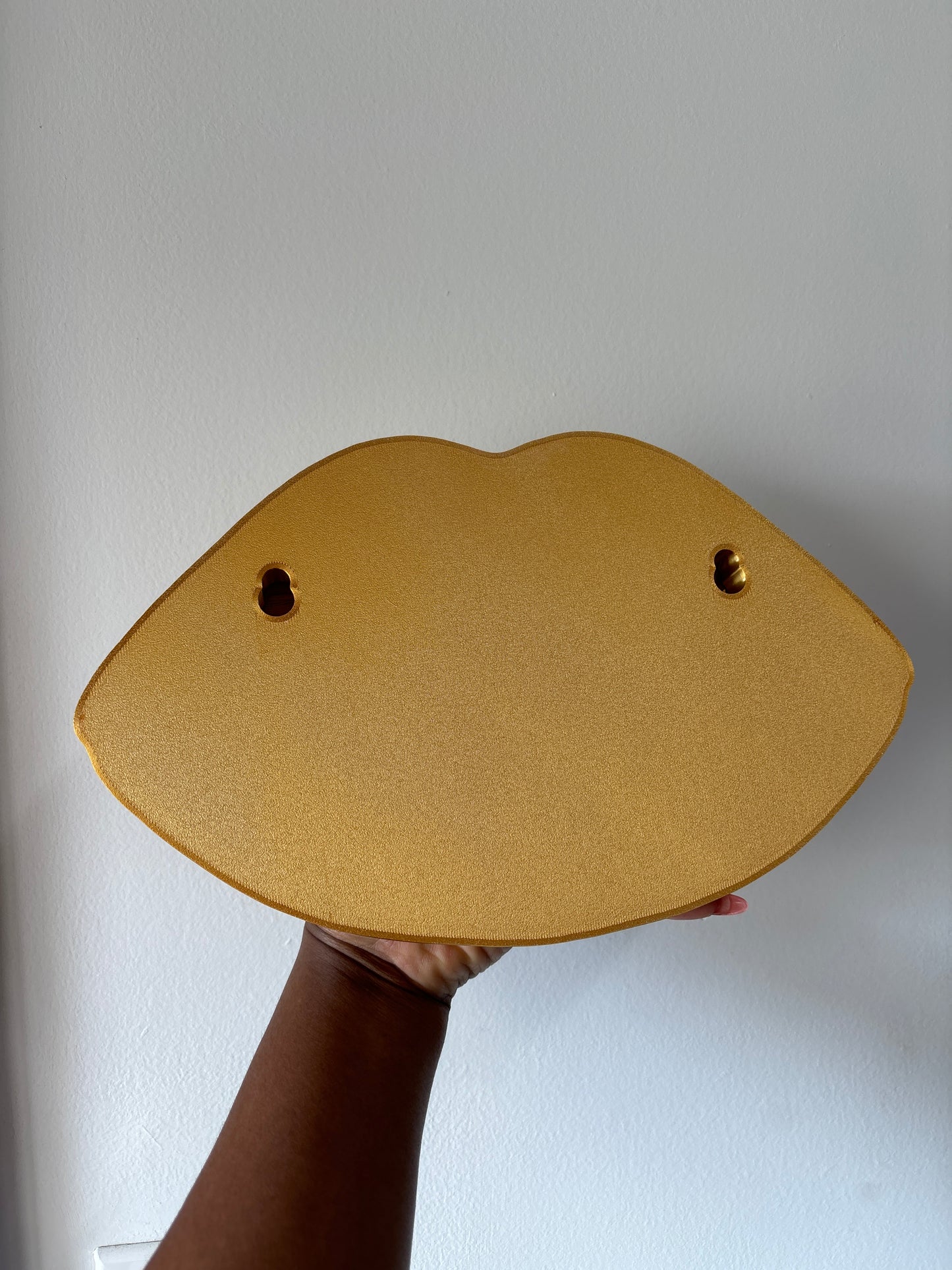 Gold lip wall decor